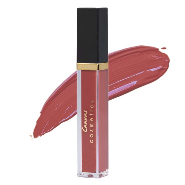 A close-up of Canvas Cosmetics Matte Liquid Lipstick in Bellini, a deep red shade, with a color swatch behind it.
