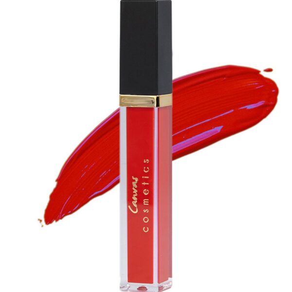 A close-up of Canvas Cosmetics Matte Liquid Lipstick in Rumba, a bold red shade, with a color swatch behind it.